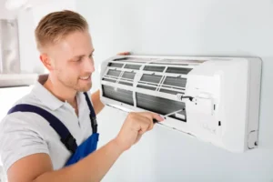 depositphotos_137856588-stock-photo-technician-repairing-air-conditioner